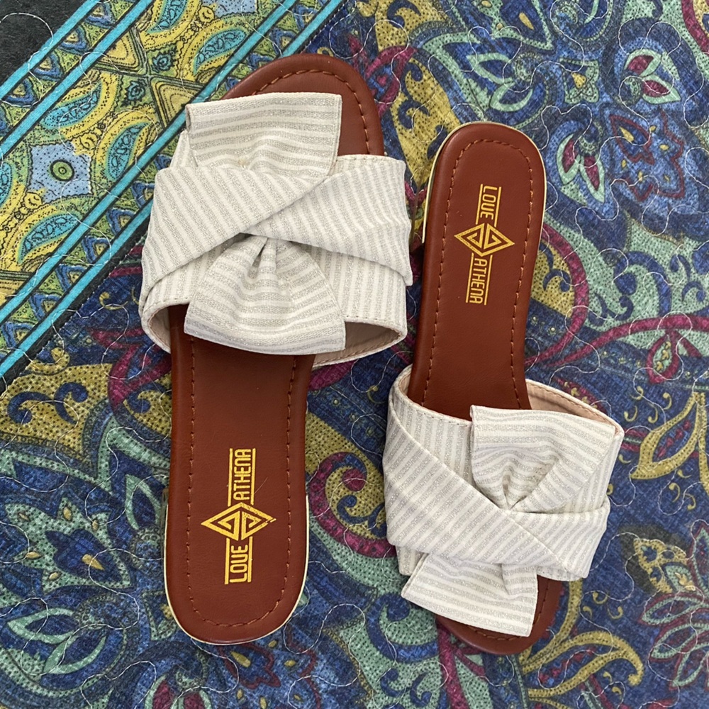 Slides w/ “white sand” canvas band w/ silver sparkle stripes, knotted over toes